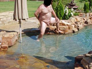 Hubby naked and nervous in our pool...our female neighbor was in her back yard with her female friends and hubby's cock was open for display!  I wonder if they got a look?  It made me wet and horny for sure seeing my man naked and vulnerable!!!