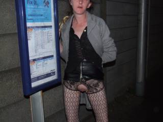 Stood at a bus showing off her pussy