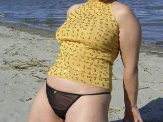 I'd love to ravage that hot lil fucktart. I'd fuck her mouth right there on the beach with her on her knees and then fuck her doggystyle...ram my cock into her like a jackhammer!!!