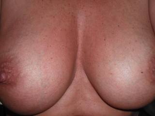 Her natural 38d tits, lovely shape and size.  What do you think?  I love to see hot cum over them.