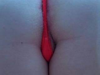 This tight red thong is really riding up my pussy lips and ass its making me so horny cum on I need help!