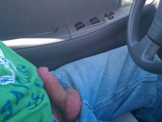 The Mr showing off his cock while driving down the road.