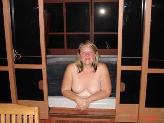 my wife nude outdoors in our hot tub