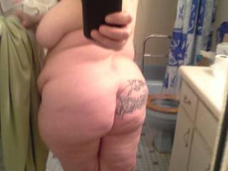 My online slave Cynthina showing her tattooed ass