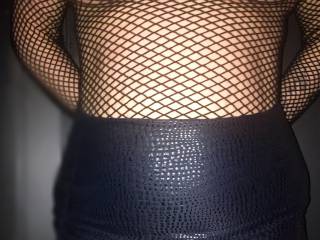 My slutty easy wife in Fishnet dress and short skirt .