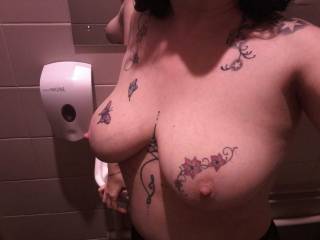 Topless again... another rest room and Sally cannot resist a mirror or new location!