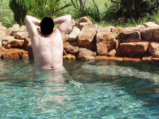 Hubby in our pool, just like I like to keep him...NUDE!  Wanna get wet with him?