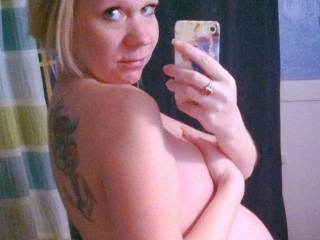8 month pregnant wife showing off