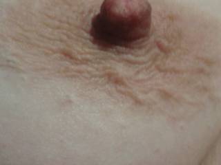 My Wife\'s Beautiful Nipple and Areola after being Stroked by my fingers. 
Do you like??