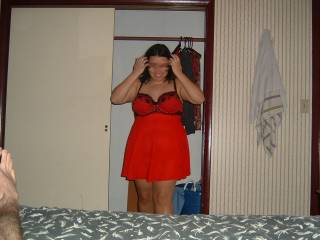 Showing off a new babydoll as hubby takes pics.