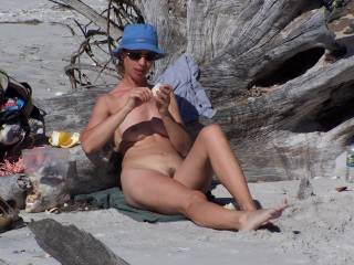 nude women sunbathing on beach