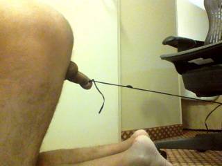 Pulling chair with my tied cock