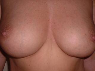 My 38D tits.  Mr Oz loves to suck and play with them and he loves to cum over them too.