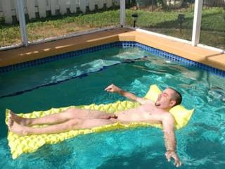 Pic my friend took of me in our friends pool getting some sun.