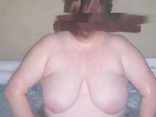 Wifes big saggy tits out in the hot tub