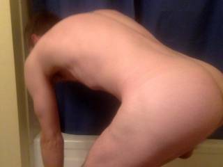 Bending over to grab my towel and show off my smooth tight ass : )