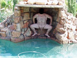 My hubby is nervously posing nude for me in our pool!  The neighbor lady and her female friends were in her backyard and had a perfect view of him had they paid attention!