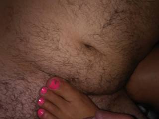 Giving my husband yet another footjob with my pink toenails which he loves! Do u like it?