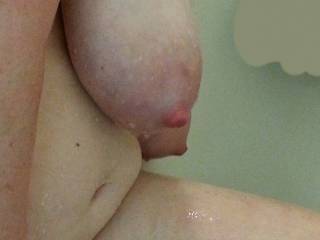 Huge milk filled lactating breasts hanging free in the shower