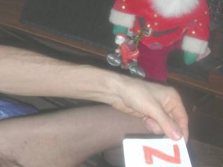 I did some toy play...so,my dick is wet with lube sitting at my desk with a Santa decoration on the edge.