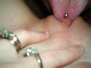 licking her clit as she holds her lips apart!  Who needs some tongue?