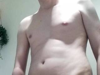 My cock after a shower became erect after seeing my naked body in the bathroom that has full size mirrors.