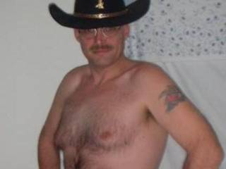 Howdy Pardner...That Hairy Chest would feel so Good Rubbing up next to my Tits...;~)