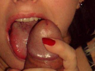 Dripping precum into her mouth