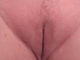 The wife's freshly shaved pussy.